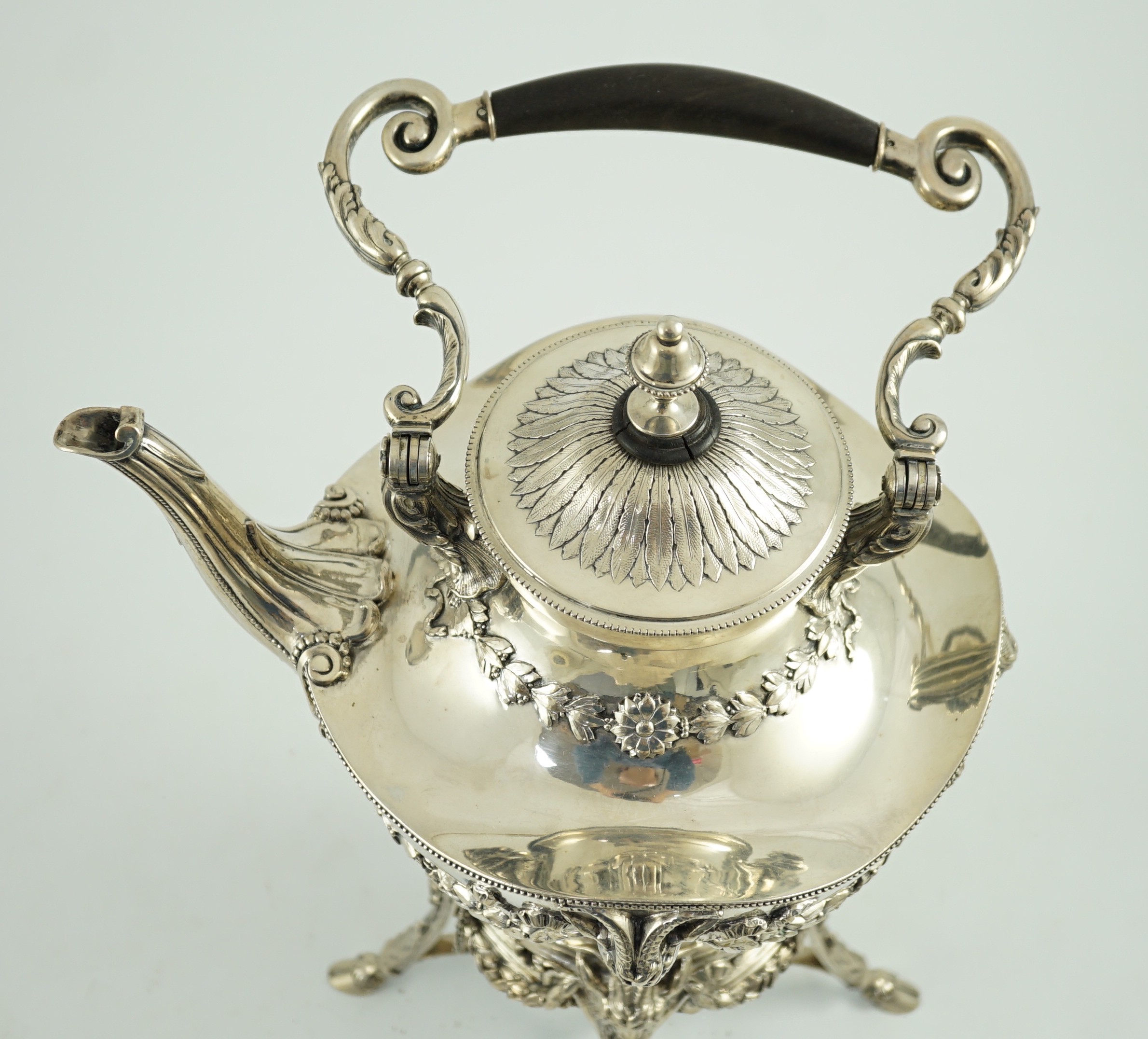 An ornate late 19th/early 20th century Austro-Hungarian 800 standard silver tea kettle on stand